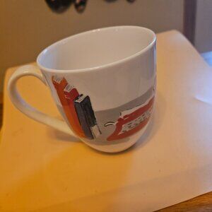 Kate Spade lenox muses academic coffee mug has illustrations of desk chairs ect